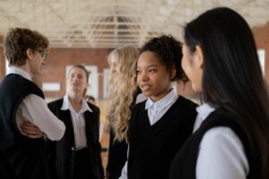 Students standing around talking at boarding school