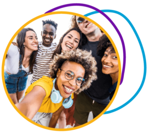 group of happy looking people hugging and laughing with one another